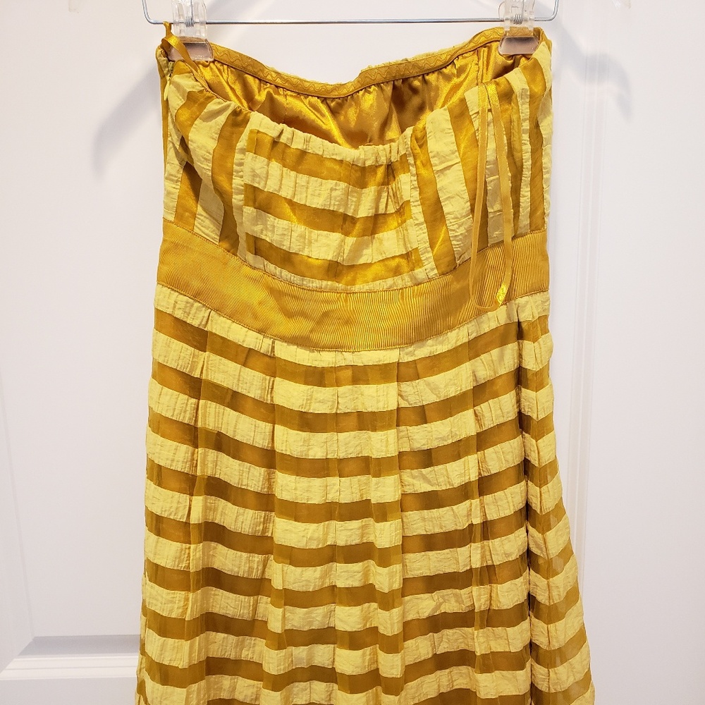 The limited strapless golden yellow dress